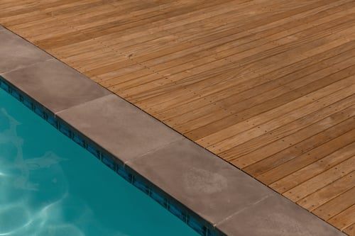 Pool waterline tile and coping edge